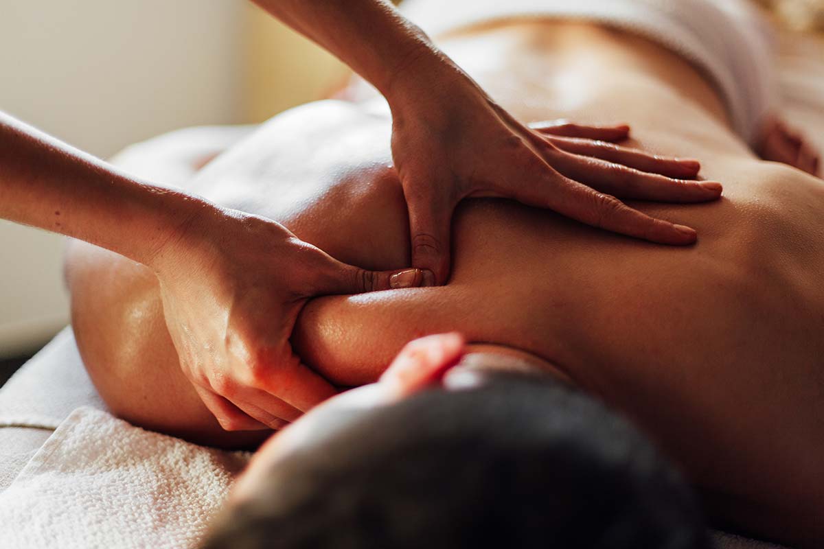 Close-up of a therapeutic back massage highlighting the use of FSA for massage therapy benefits.